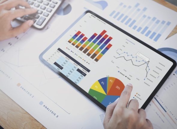 businesswoman-using-tablet-analysis-graph-company-finance-strategy-statistics-success-concept-planning-future-office-room-scaled
